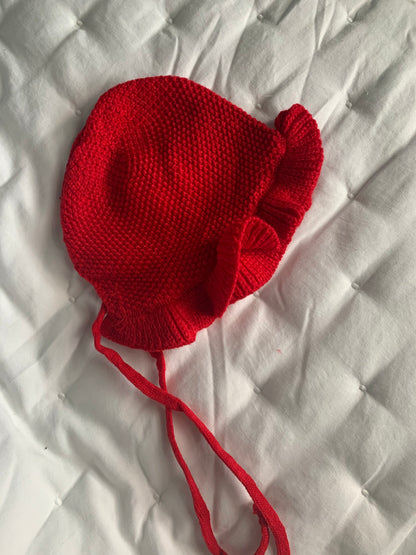 Red knitted baby hat