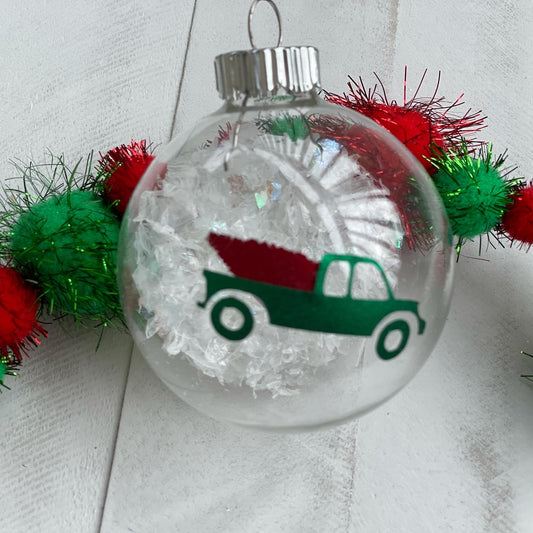 Green truck with red Christmas tree